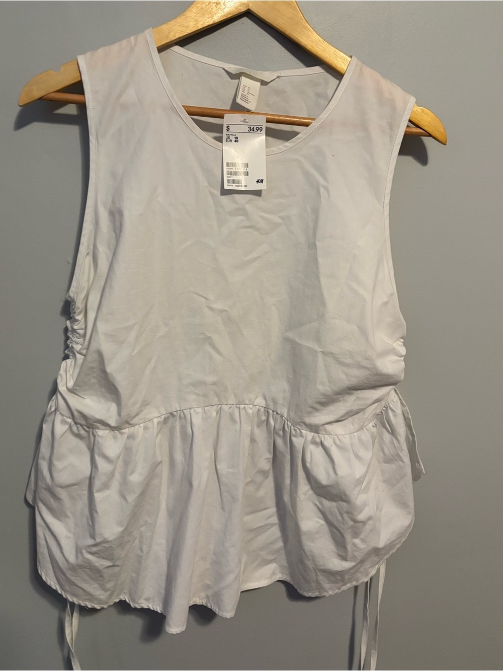 H&M White Sleeveless Peplum Tunic with Side Ties